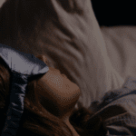 Woman sleeping with eye mask.