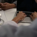 woman typing on a laptop