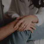 A couple holding hands, symbolising emotional connection, support, and fertility health.